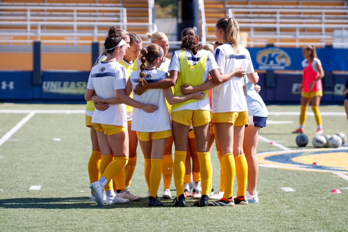 The Kent soccer team huddle during warmup before their match against Ball State University, Sept. 22, 2024. 