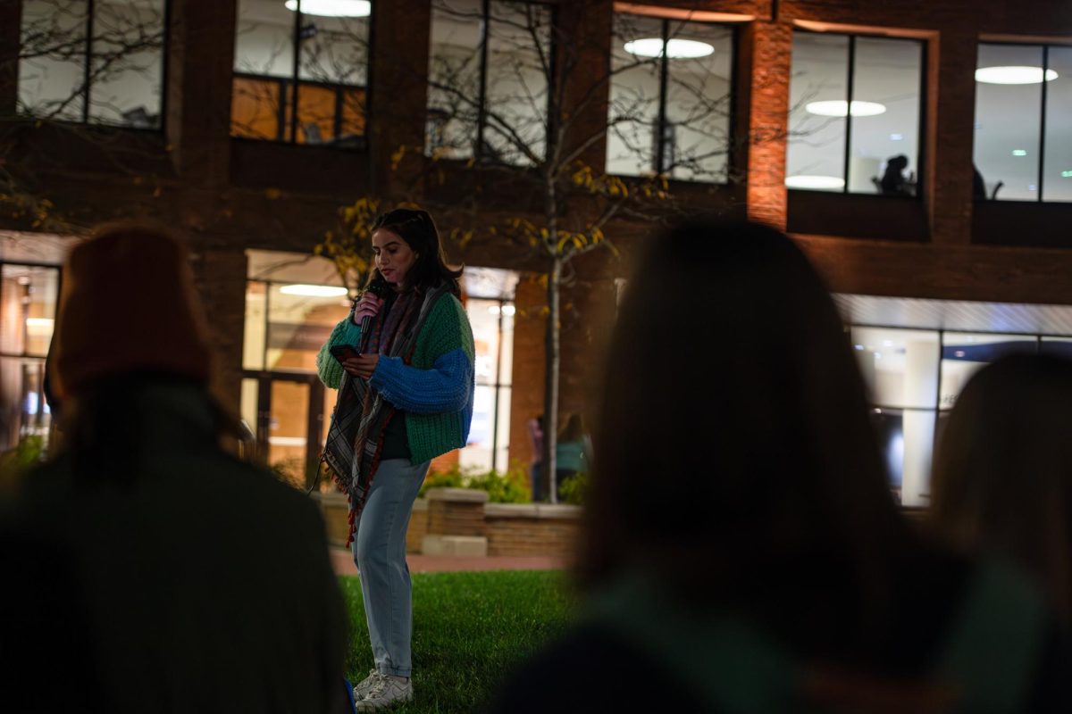 Kent political science junior Katey Berry, a member of the Jewish Voices for Peace, speaks during the Students for Justice in Palestine's candelight vigil, Thursday, Oct. 11, 2024.