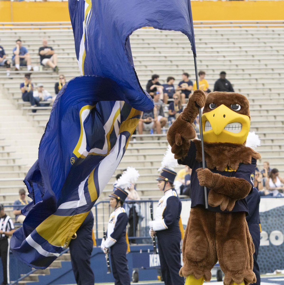 At the Homecoming football game against Eastern Michigan, Sept. 28, 2024, Flash the Golden Eagle waves a flag for the crowd.