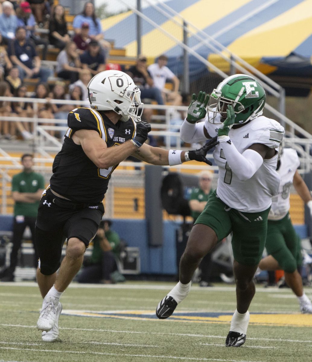  Sept. 28, 2024, graduate student wide receiver Luke Floriea (0) holds off Eastern Michigan junior defensive back Dramarian McNulty (7) as KSU attempts to catch the ball.