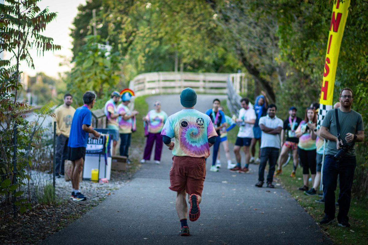 A runner is about to cross the finish line for the Drag Race 5k on Oct. 11, 2024.