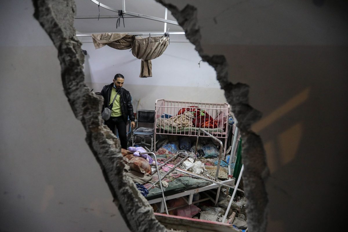 People inspect the damage caused by an artillery shell that hit the maternity hospital inside the Nasser Medical Complex, in Khan Younis, Gaza on December 17.