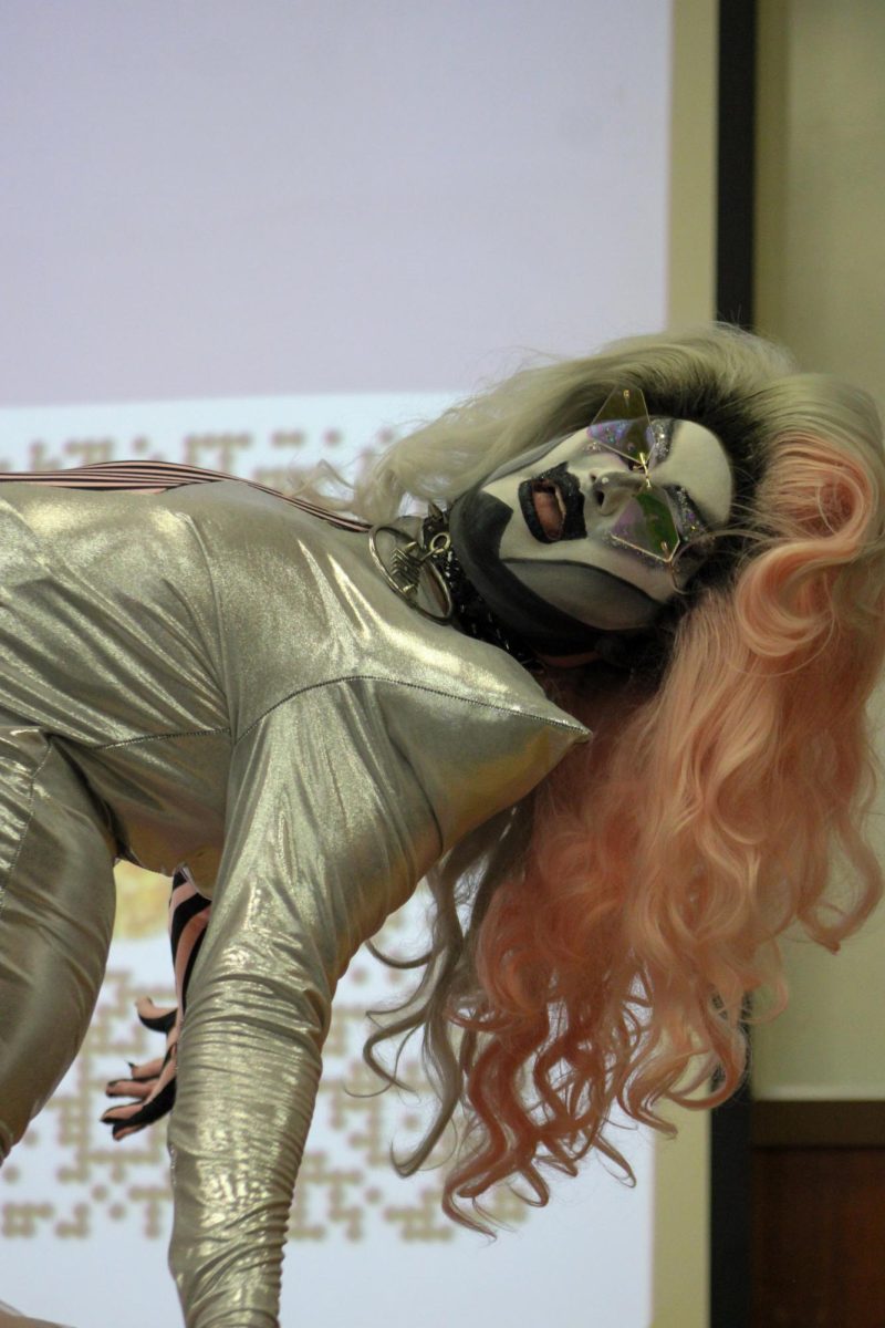 Drag artist Comatose performs for an audience in Bowman Hall Oct. 29 during a 'Drag Out the Vote' event.