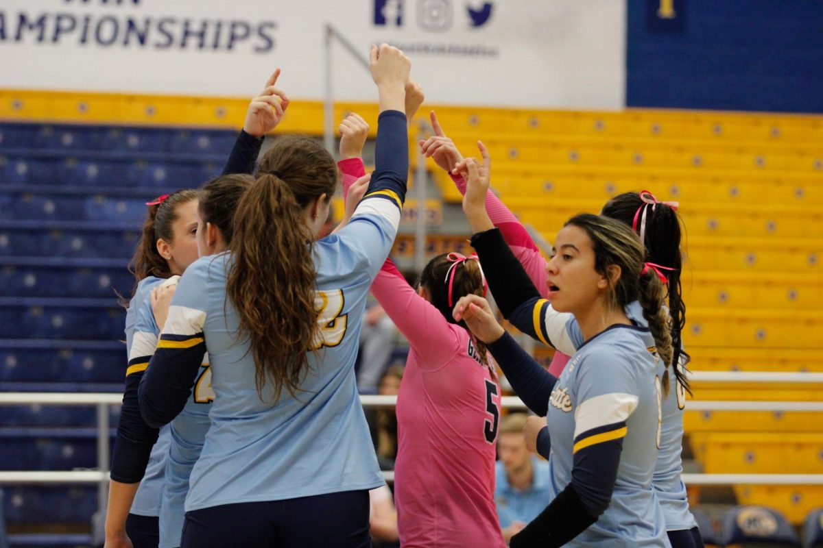 Kent State University volleyball team huddle before their match against Ball State University on October 19,2024. 