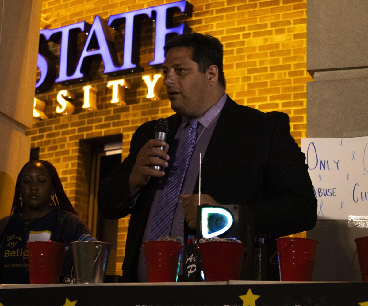 Oct. 8, 2024, interim Dean of Students Todd Kamenash shows his support at the Take Back the Night march.