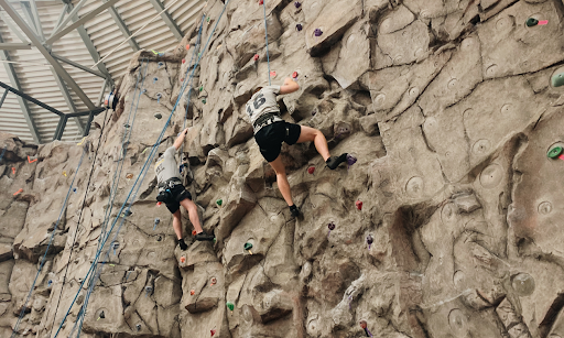 People climbing on the Rec Center Rock Climbing Wall. 