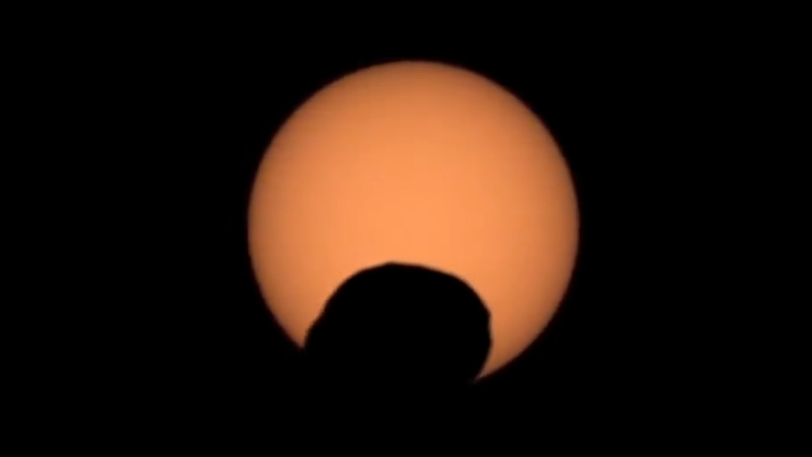 Mars' moon Phobos creates a "googly eye" as it passes between Mars and the sun. 