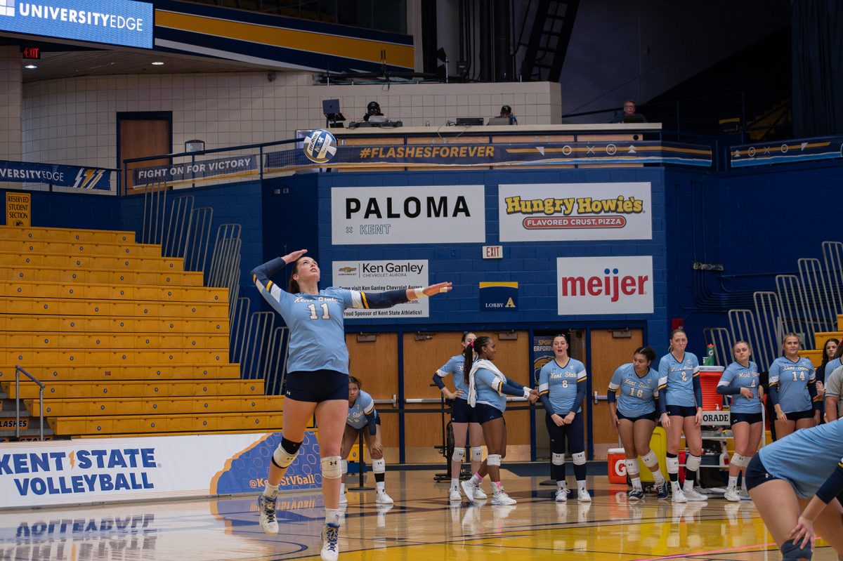 Junior Mackenzie McGuire serves the ball at the game on Oct. 19, 2024.