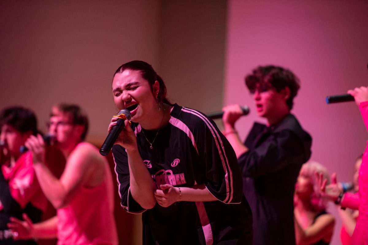 Fourth year nursing major Kylee Worner sings during Vocal Intensity's Bring the Beat In concert at the KIVA, Friday, Nov. 22, 2024.