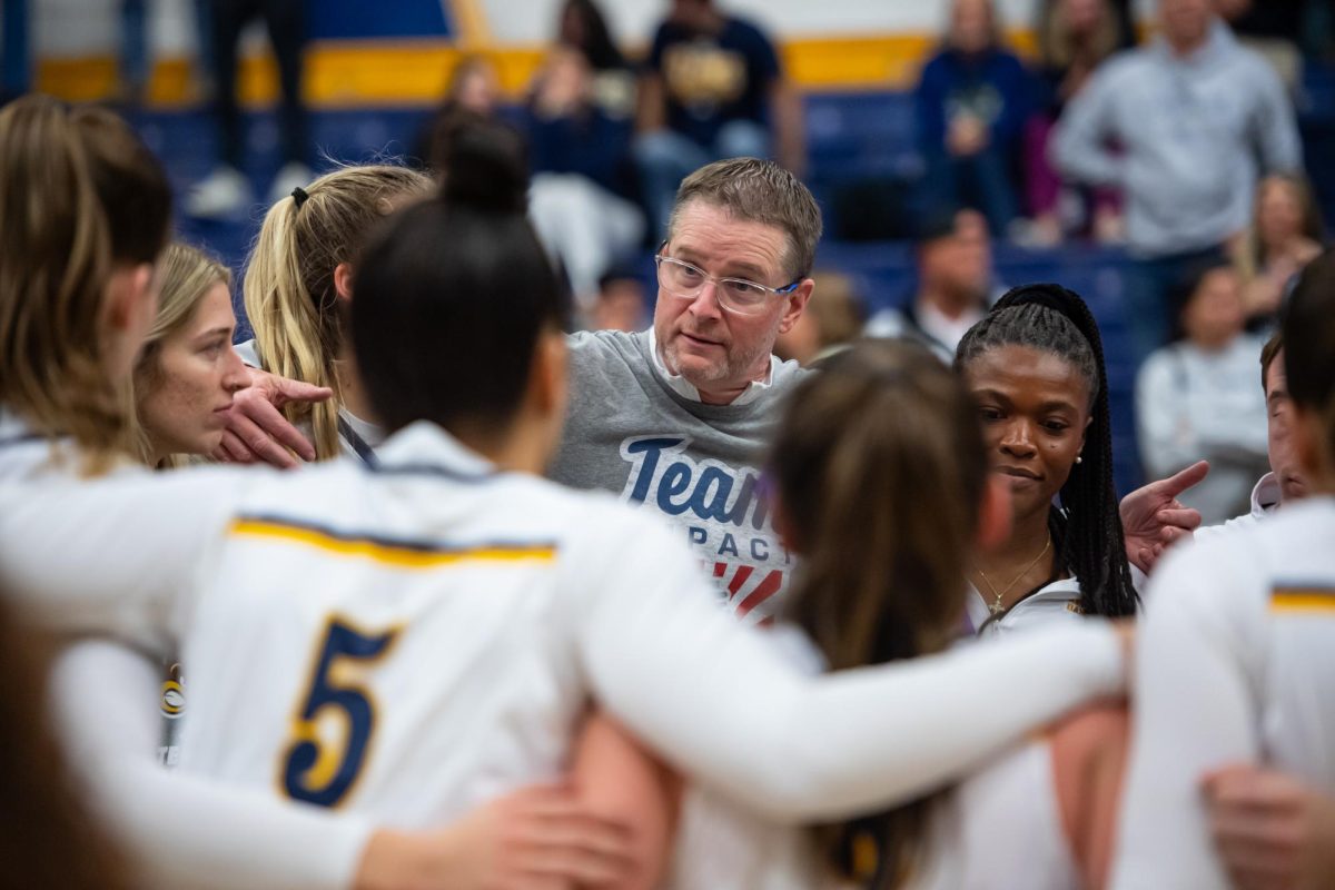 Head coach Todd Starkey speaks with the women's basketball team after their victory of Xavier Nov. 23, 2024.