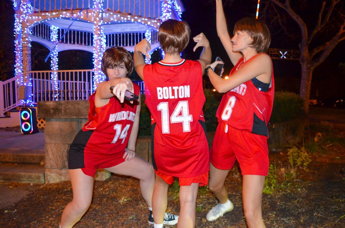 Elena Novak, Natalie Beres, and Maria Wolff are all three the main characters as they dress as Troy Bolton on November 2, 2024, in Downtown Kent, Ohio. 