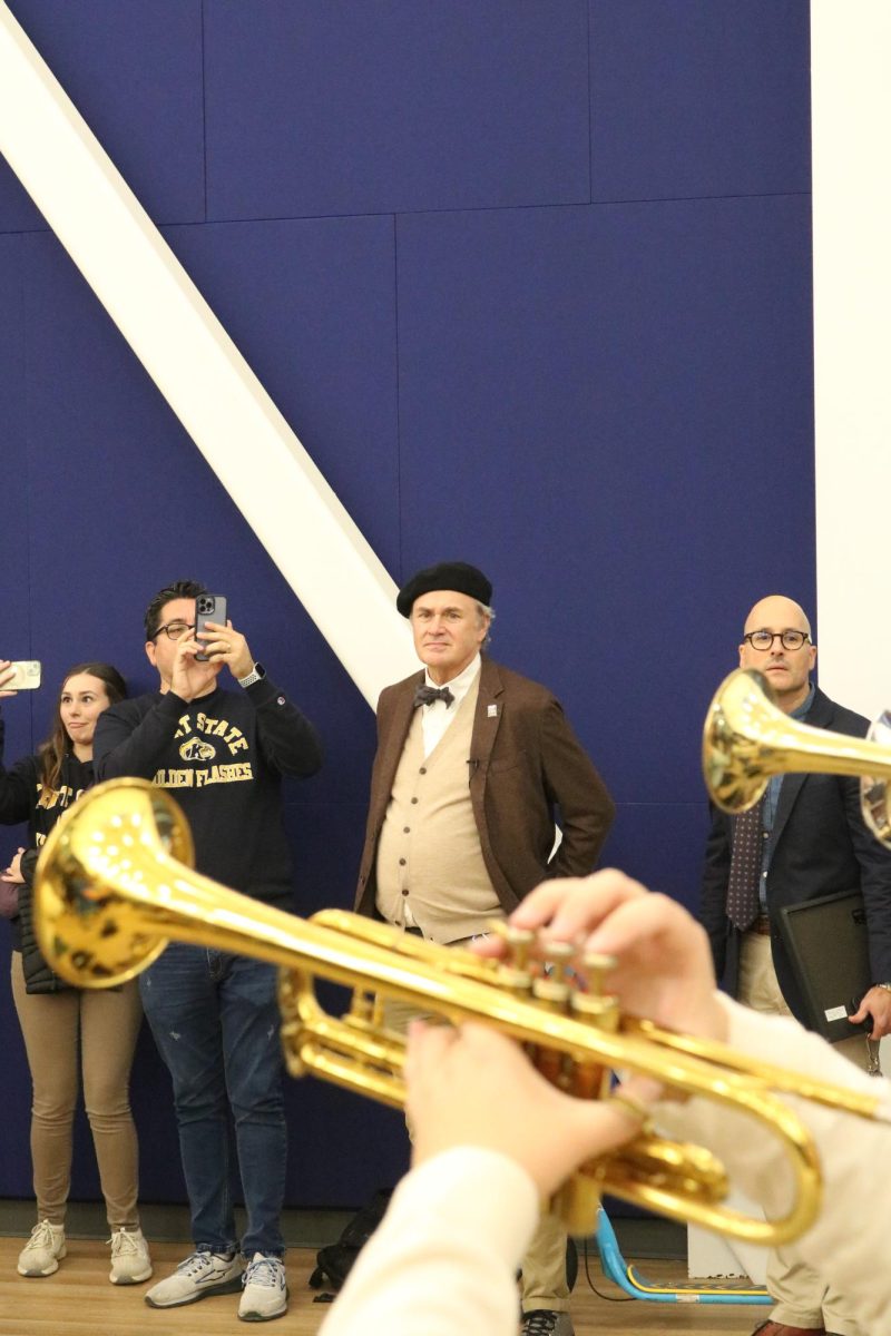 Kent State University's president, Todd Diacon, watches as the KSU band sound checks their new practice room in the Ince Rink on November 15, 2024.
