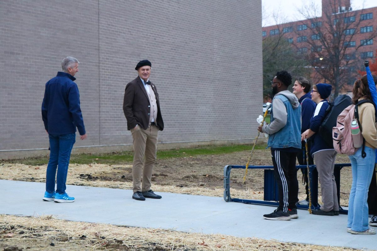 Kent State University's President Todd Diacon and band director leads the band into the newly renovated practice space inside of the ice rink on campus on November 15, 2024. 