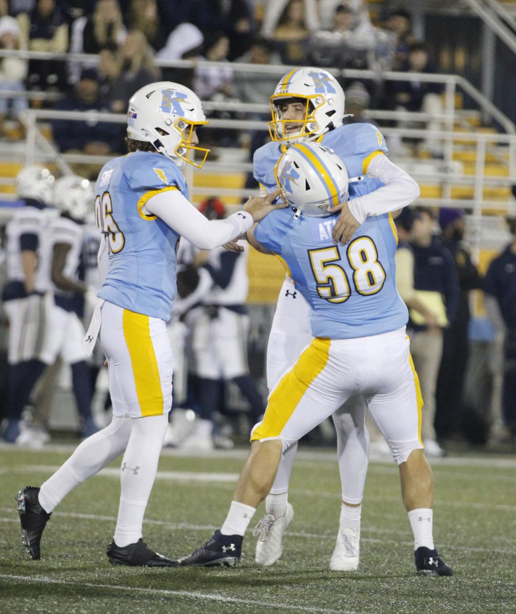 Kent State University players celebrate after a successful play in their rival match against Akron University on November 19,2024.