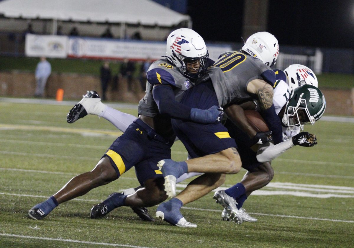 Kent State University football players tackled a Ohio University player during their game on November 6,2024. 