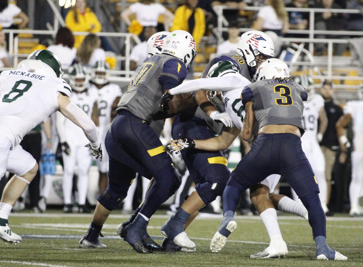 Kent State University football players tackled a Ohio University player during their game on November 6,2024. 