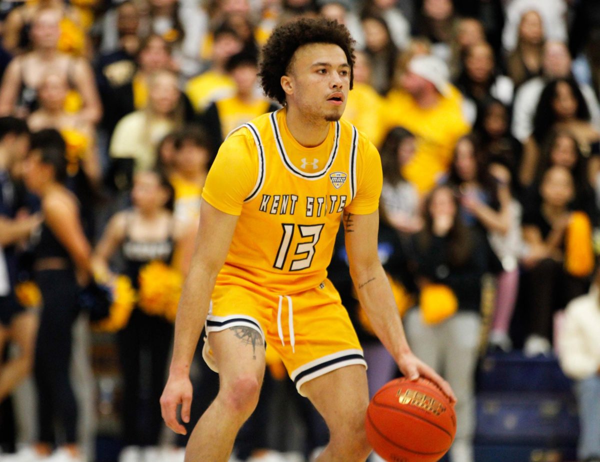 Kent State University senior guard Jalen Sullinger dribbles the ball down the court in their match against Akron University on Jan. 31, 2025. 