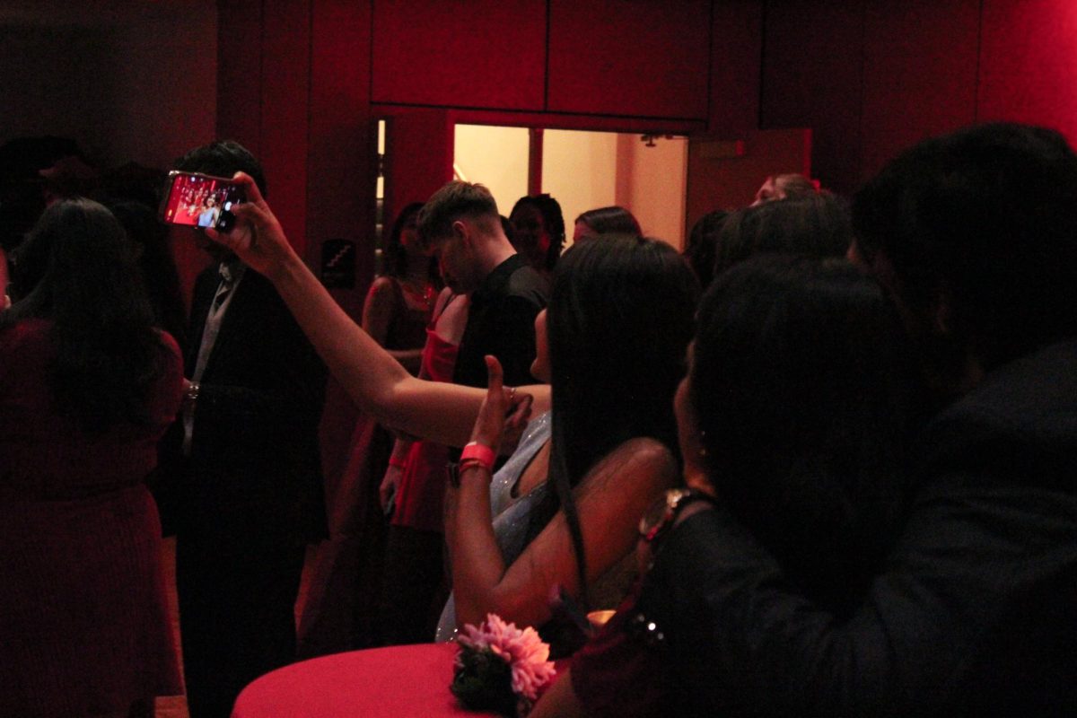 Students take a selfie at FAB's Red Dress Gala on Feb. 8th, 2025.