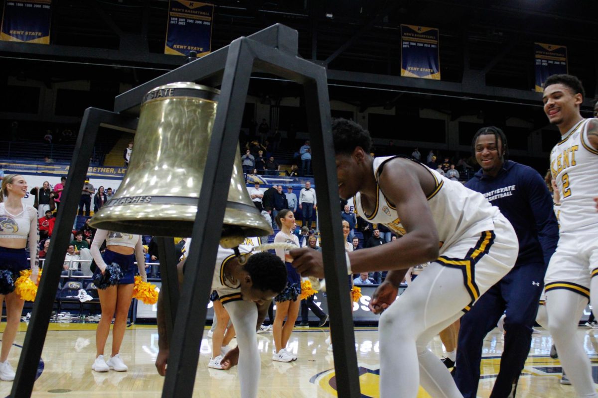 Kent junior Delrecco Gillespie, 23, rings the victory bell after their win against Arkansas on Saturday, Feb 8. 2025.