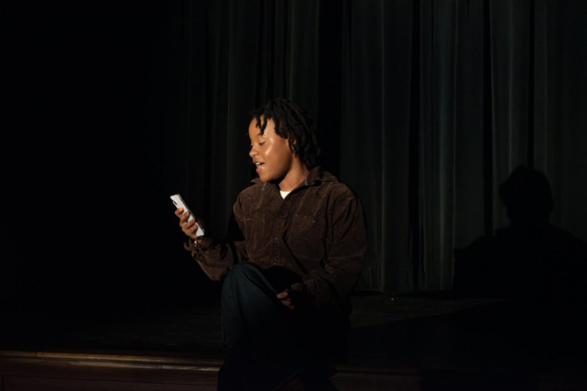 Maiya Dixon reading a poem during the Kuumba Night located in Oscar Ritchie Hall on Thursday, Feb. 20th, 2025.