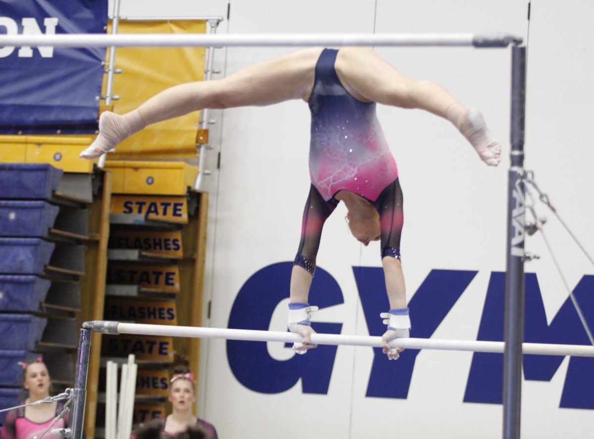 Kent State University junior gymnast Nastia Rudnitskaya performing her uneven bar routine in their match against Western Michigan University on Feb. 2, 2025. 