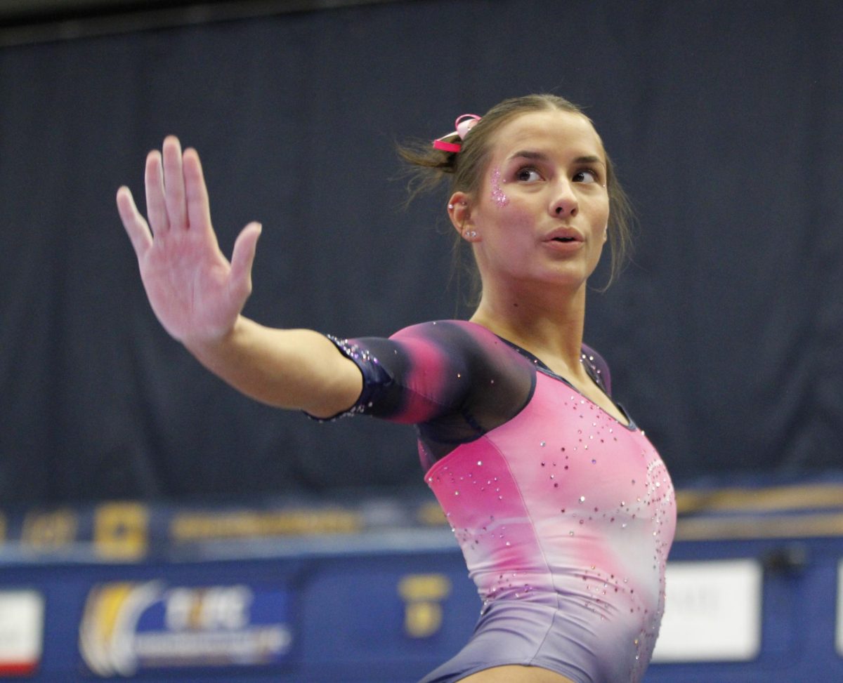 Charlie Behner, Kent State junior, competes in the floor event against Western Michigan University Gymnastics on Feb. 2, 2025.  