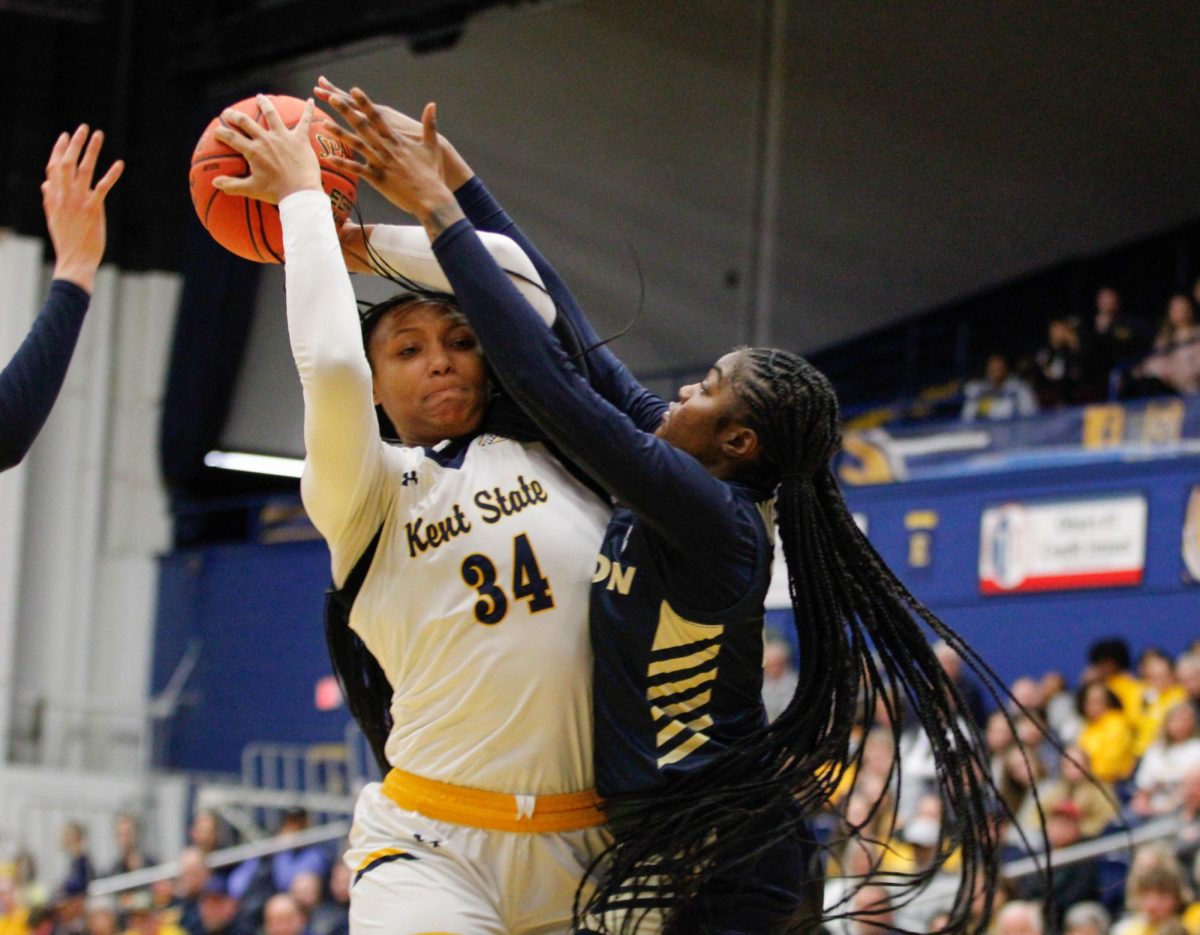 Kent State University sophomore forward Janae Tyler, 34, going up for the layup as a Akron University player tries to block her in their match on Feb. 1, 2025. 