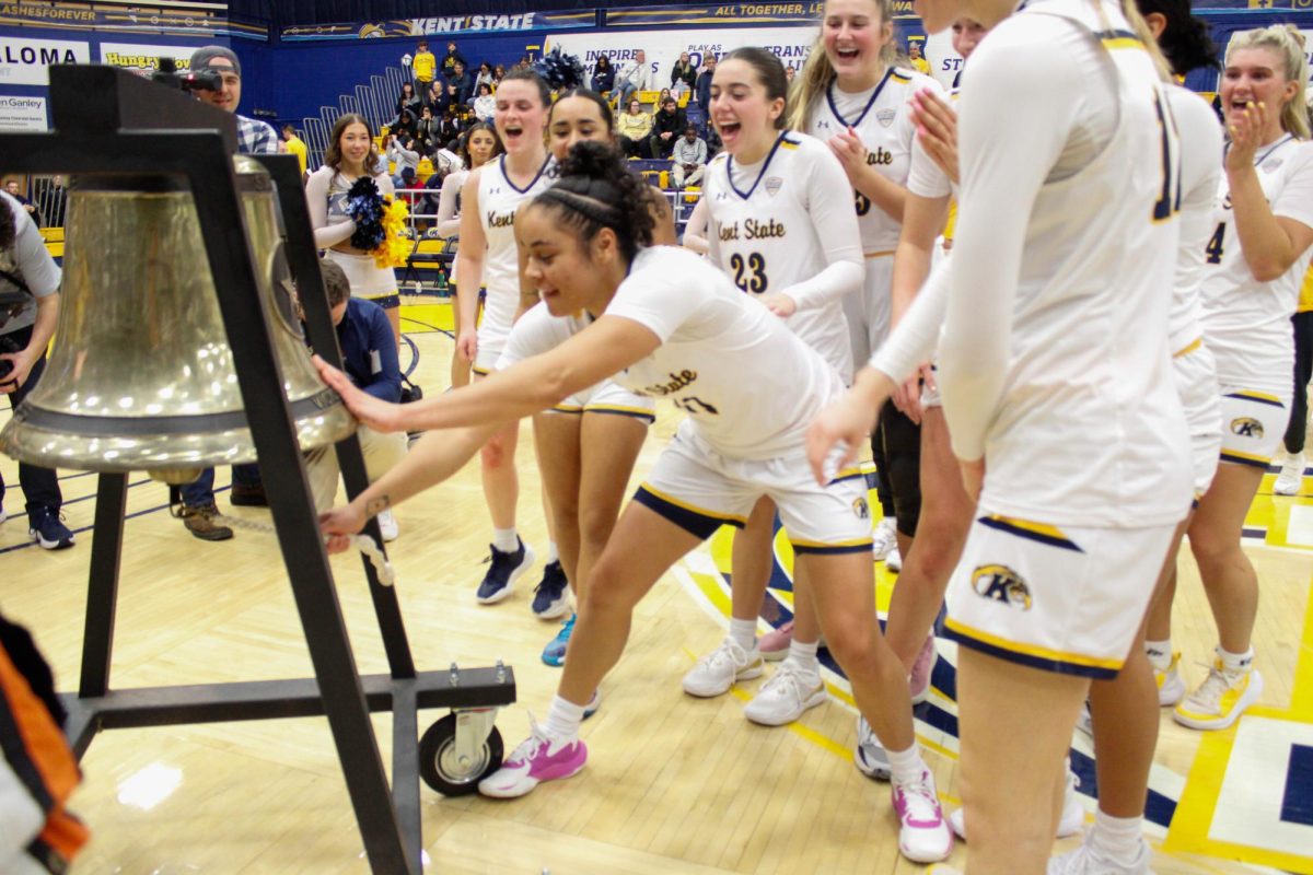 Kent State University Women's Basketball team ringing the victory bell after they won against University of Akron on Feb. 1, 2025. 