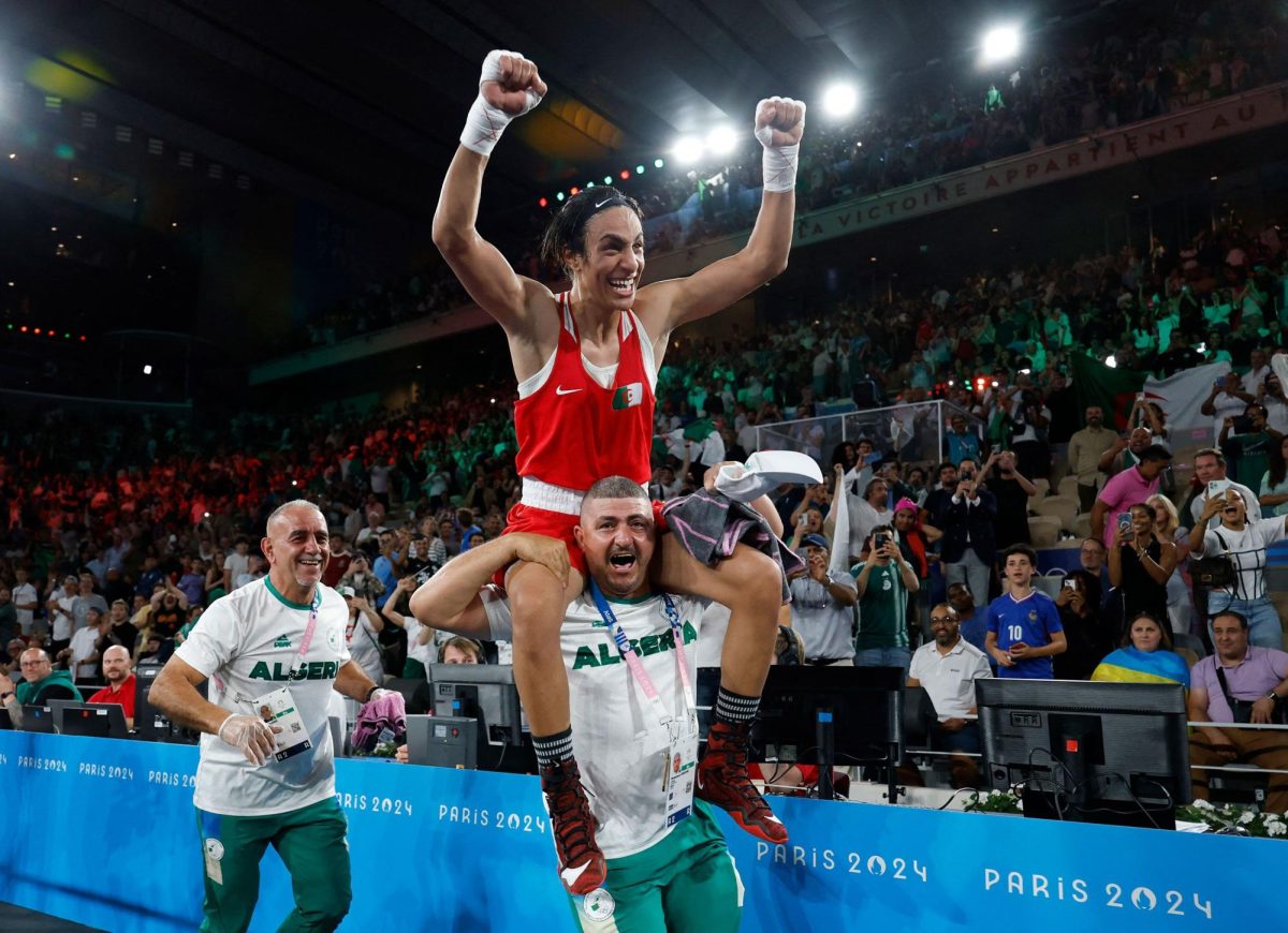 Algeria's Imane Khelif celebrates winning at the Olympics.