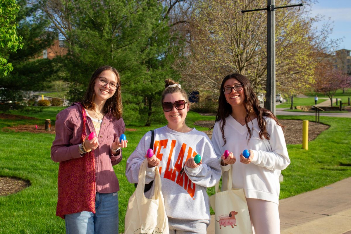 Paige Brownson(Left), speech language pathology major, Brodie Sikorski(Center), marketing major, and Alexis Spears(Left) hunt for eggs during FAB's Egg Hunt on April 22, 2025.