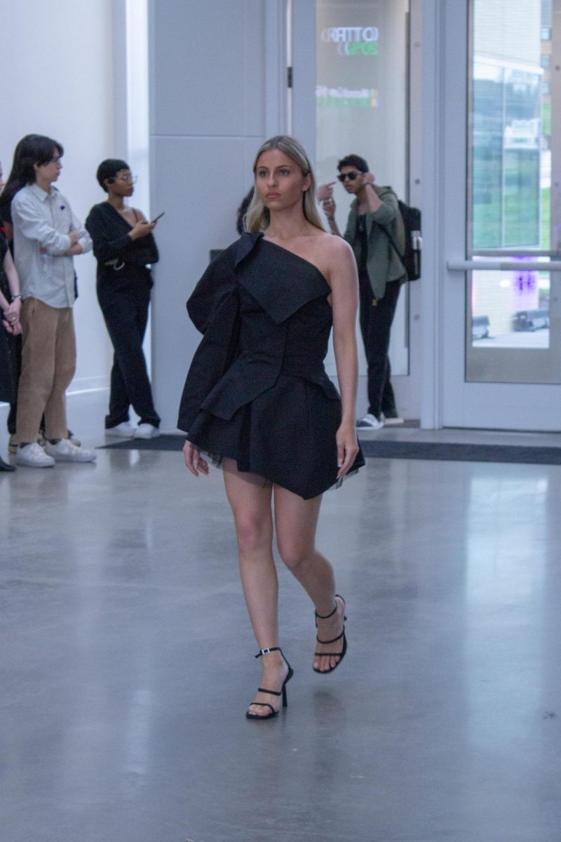 Models Alaina Snow wearing Jamie Swanson B.A. walks at Kent State Annual Fashion Show on April 24, 2025.