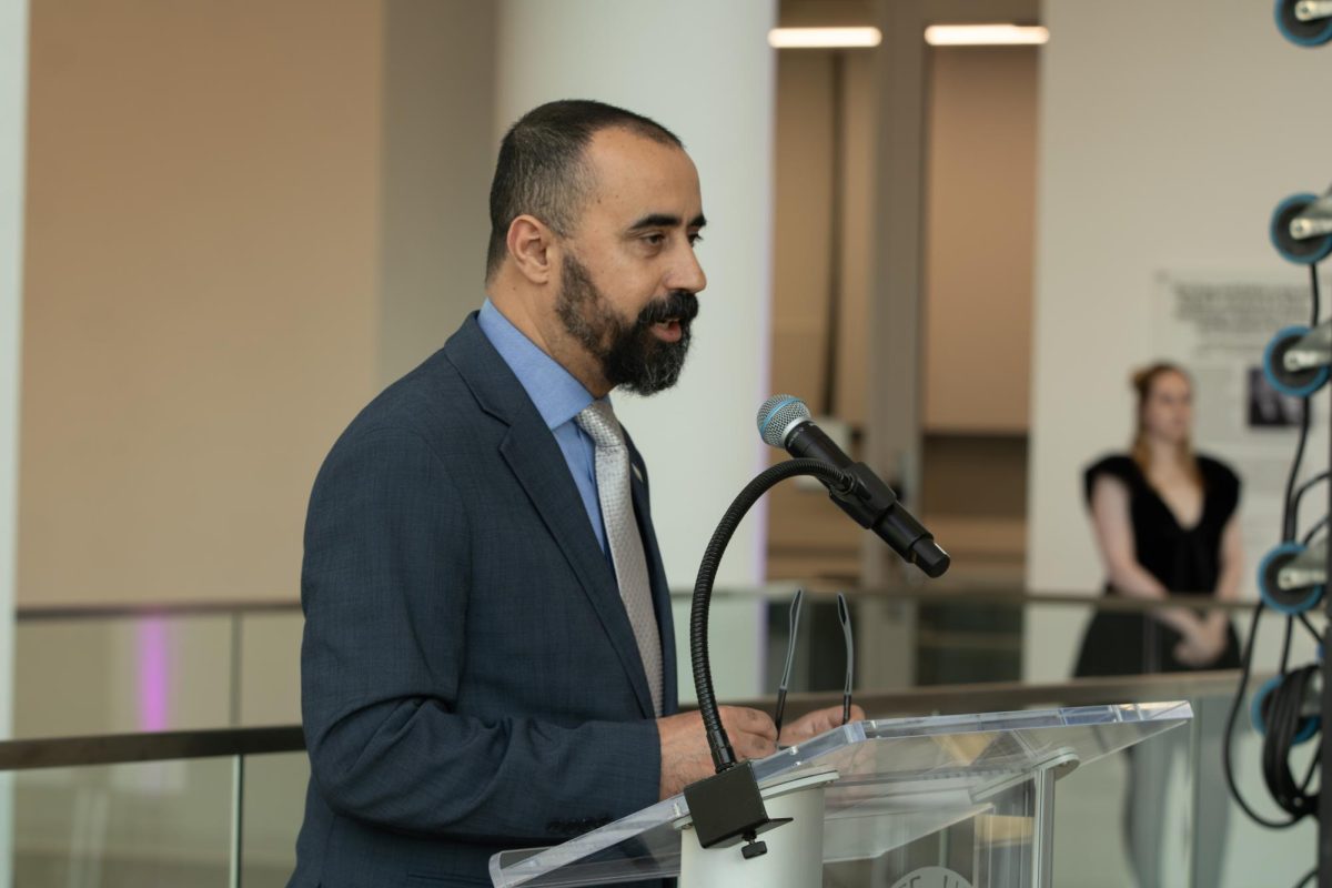 Kent School of Fashion Design and Merchandising director, Mouras Krifa gives the opening speech before the start of the annual fashion show on Thursday, April 24, 2025.