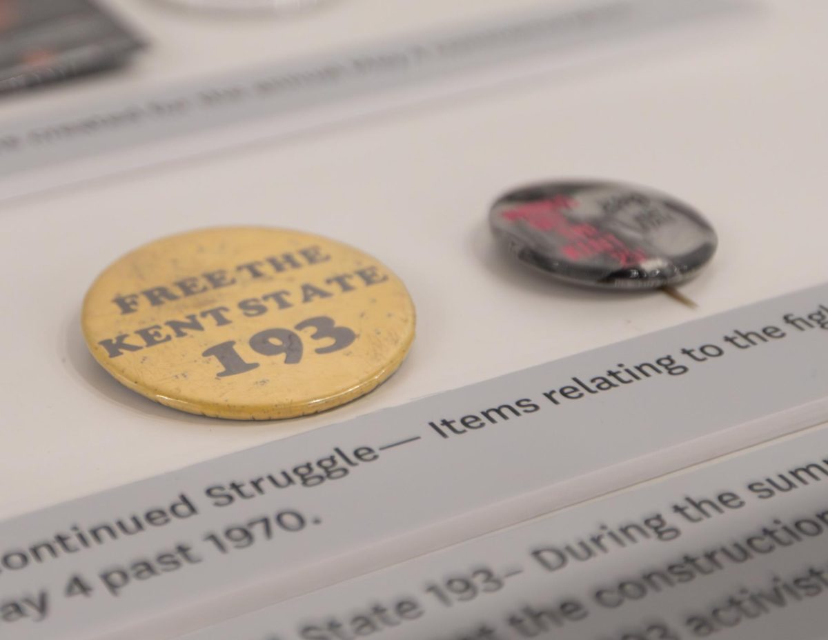 Pins from those dedicated to remembering the May 4 shooting are displayed at the "Teach Peace: Jerry Lewis" exhibit, Apr. 8, 2025.