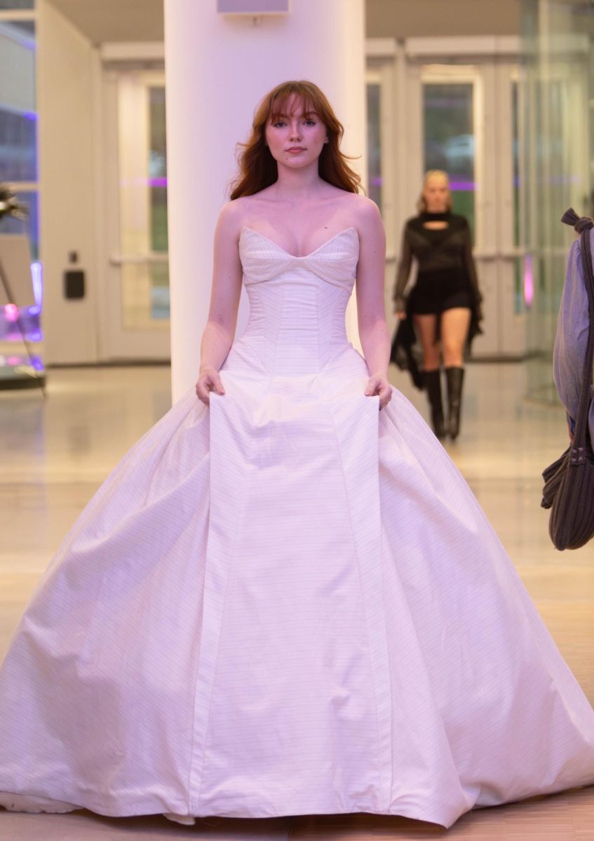 A model wears a gown designed by senior fashion design major Blaire McKnight at the annual fashion show, April 25, 2025.