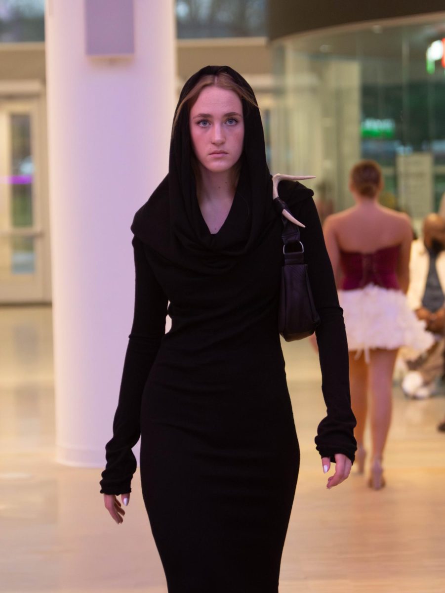 A model wears a garment designed by senior fashion design major Mandalyn Maglione at the annual fashion show, April 25, 2025.