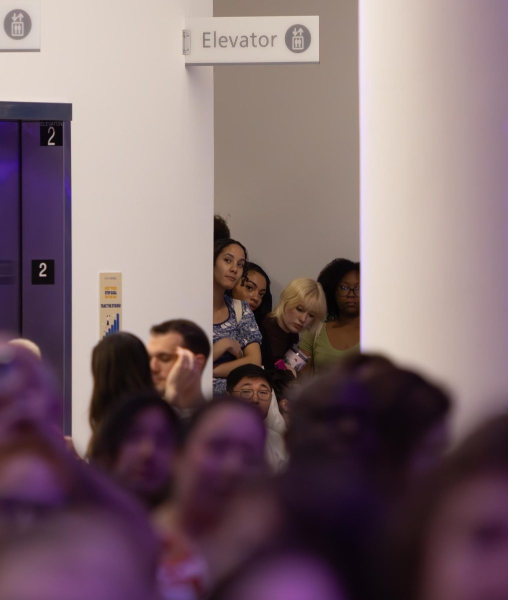 Models at the annual fashion show watch from backstage at awards are given to the designers, April 25, 2025.