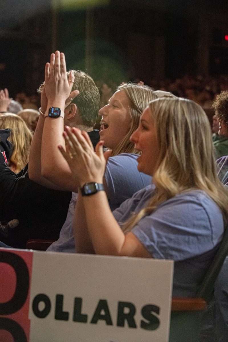 Attendees cheer for Tim Walz during his speech about different policies and issues on Monday, April 7th, 2025. 