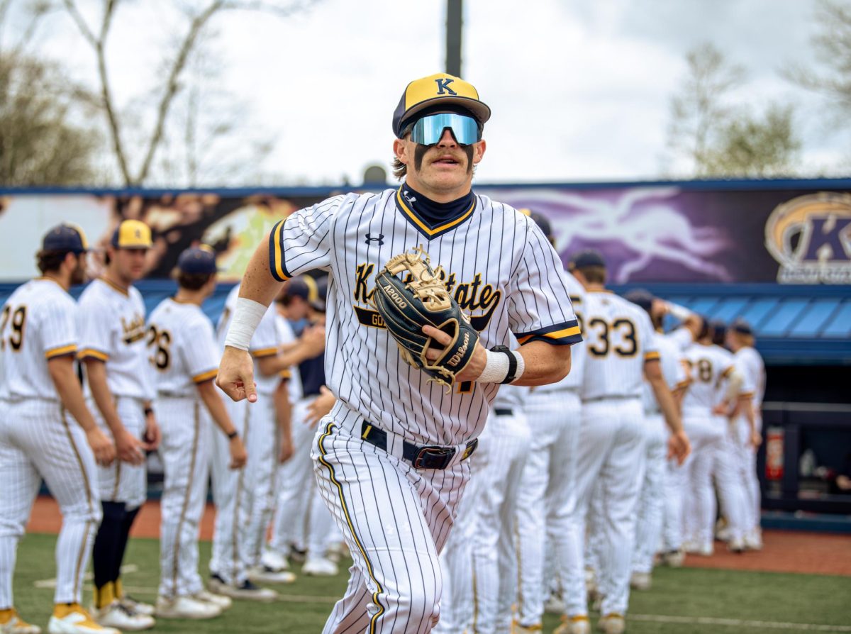Kent junior Luke Matthews runs out while his team cheers him on before the game against Akron on Friday, April 25, 2025.