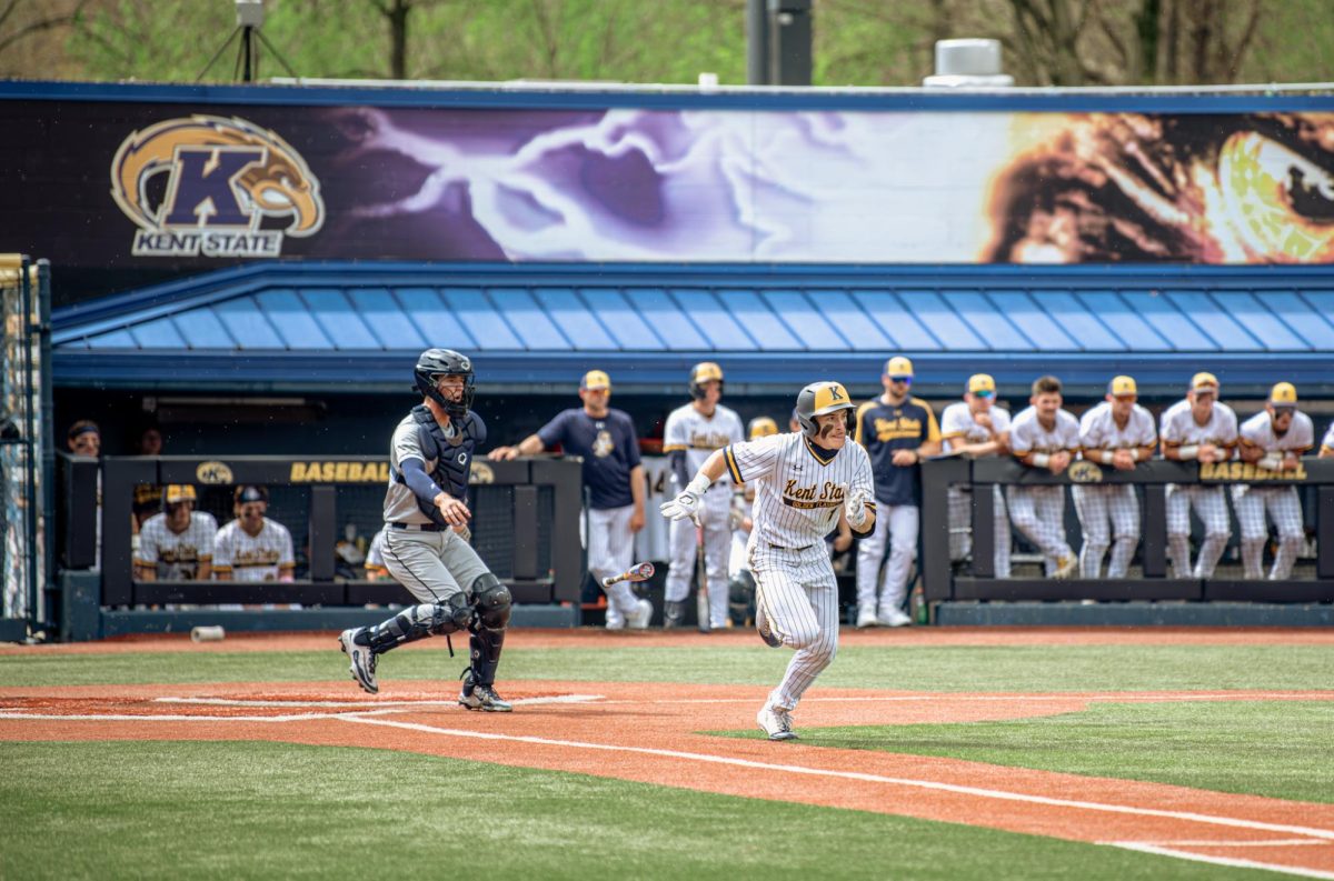 Kent junior Luke Matthews runs after bunting and makes it to first in the game against Akron on Friday, April 25, 2205. He was then called out at second during the same play. 