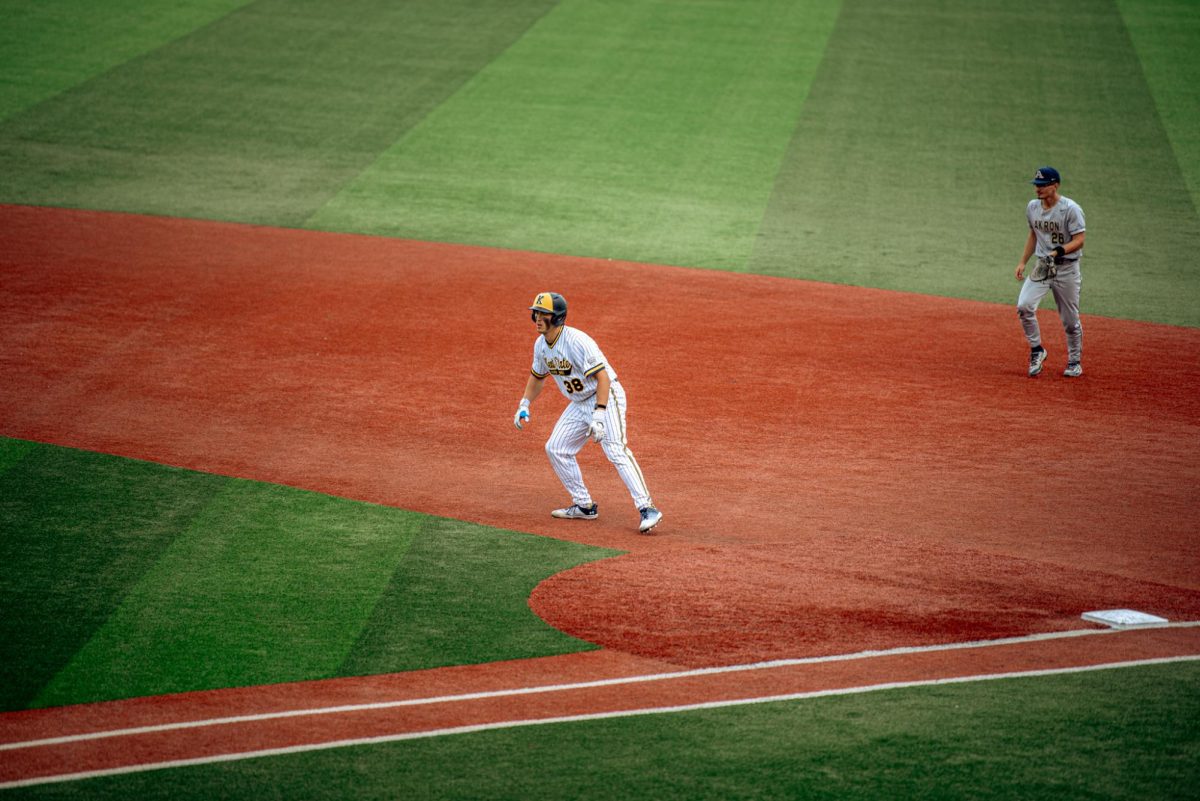 Kent freshman Sawyer Solitaria leads off first base during the game against Akron on Friday, April 25, 2025. He later scored on a double which made the score three to two with Akron in the lead. 