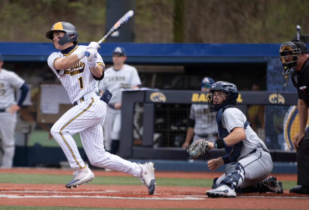 Kent junior Luke Matthews hits the ball during the bottom of the second in their game against Akron on Friday, April 25, 2025.