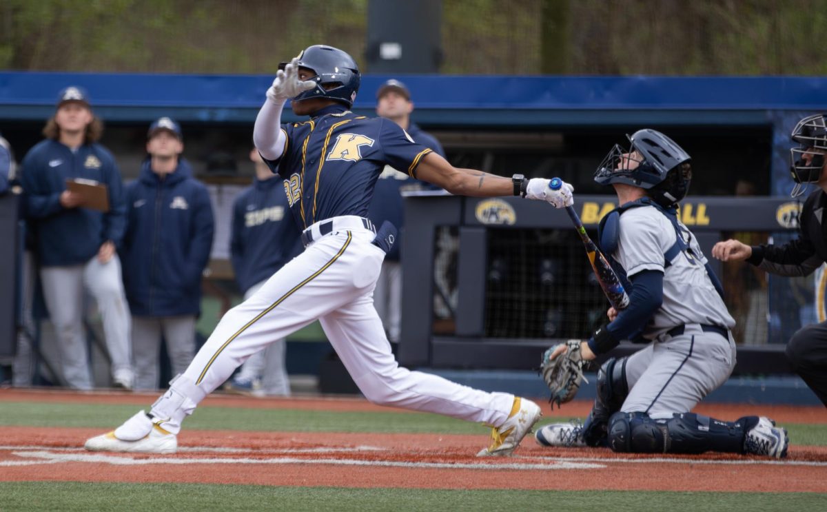 Kent freshman Micah Rienstra-Kiracofe hits the ball during the top of the second in their game against Akron on Saturday, April 26, 2025. 