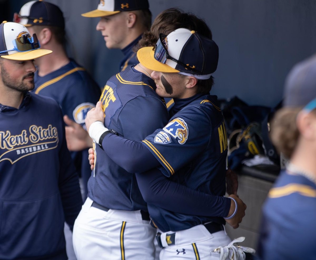 Kent junior Luke Matthews hugs redshirt freshman Landon Tiesing before the start of their game against Akron on Saturday, April 26, 2025.