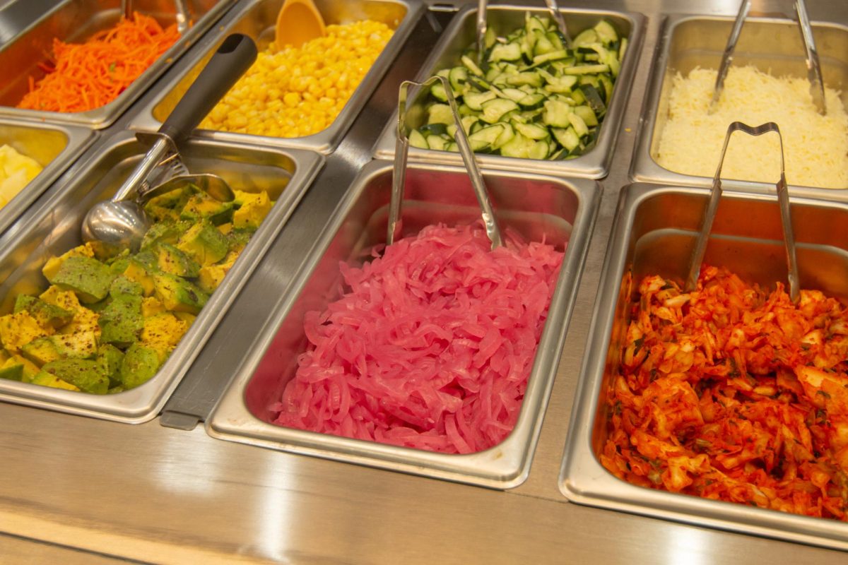 Topping options sit on display at Bibi Bop Opening on May 22, 2025.