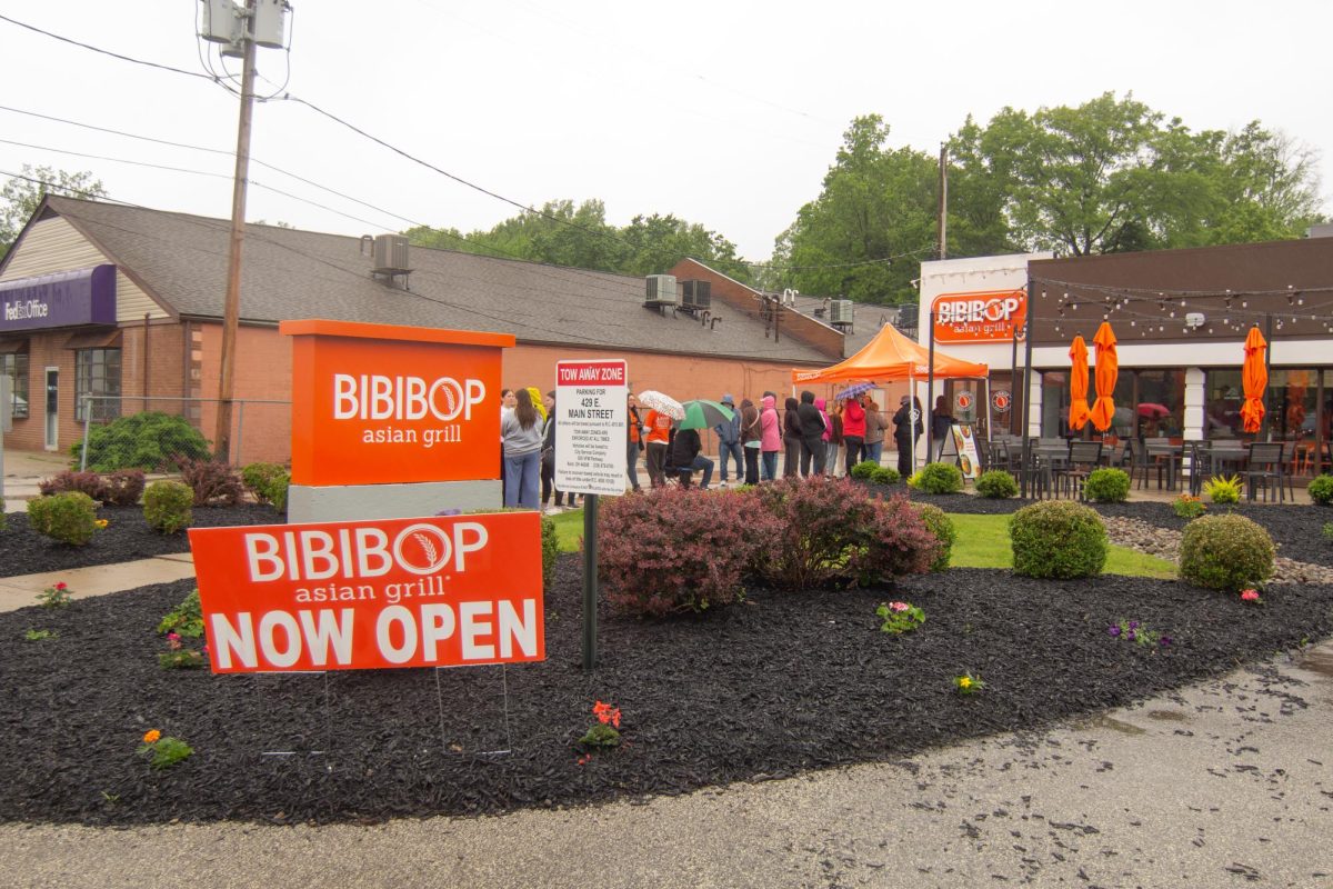 Kent citizens stand for Bibi Bop Grand Opening on May 22, 2025.