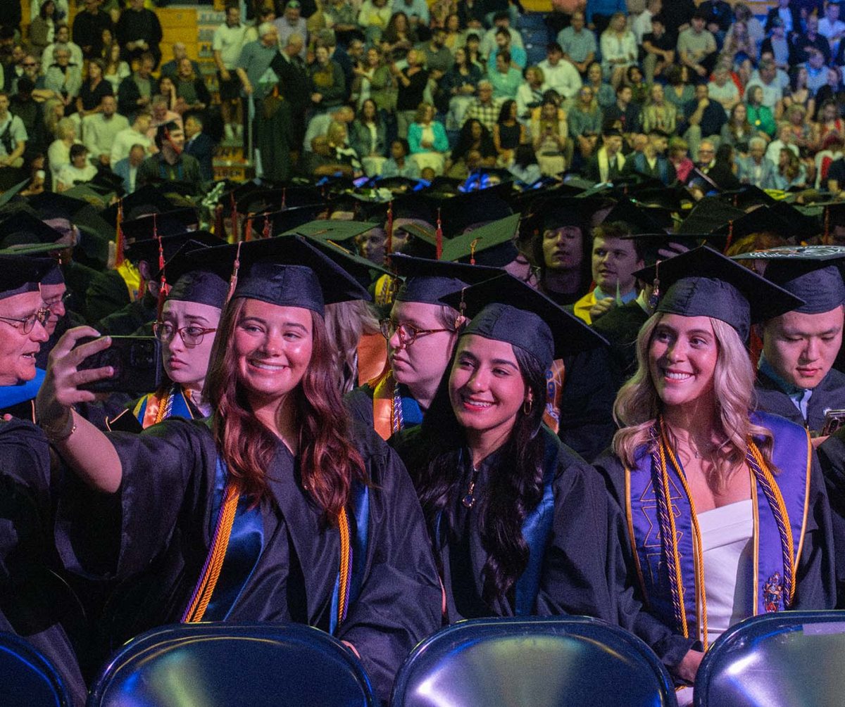 Kent graduates take a selfie during commencement on May 10,2025. 
