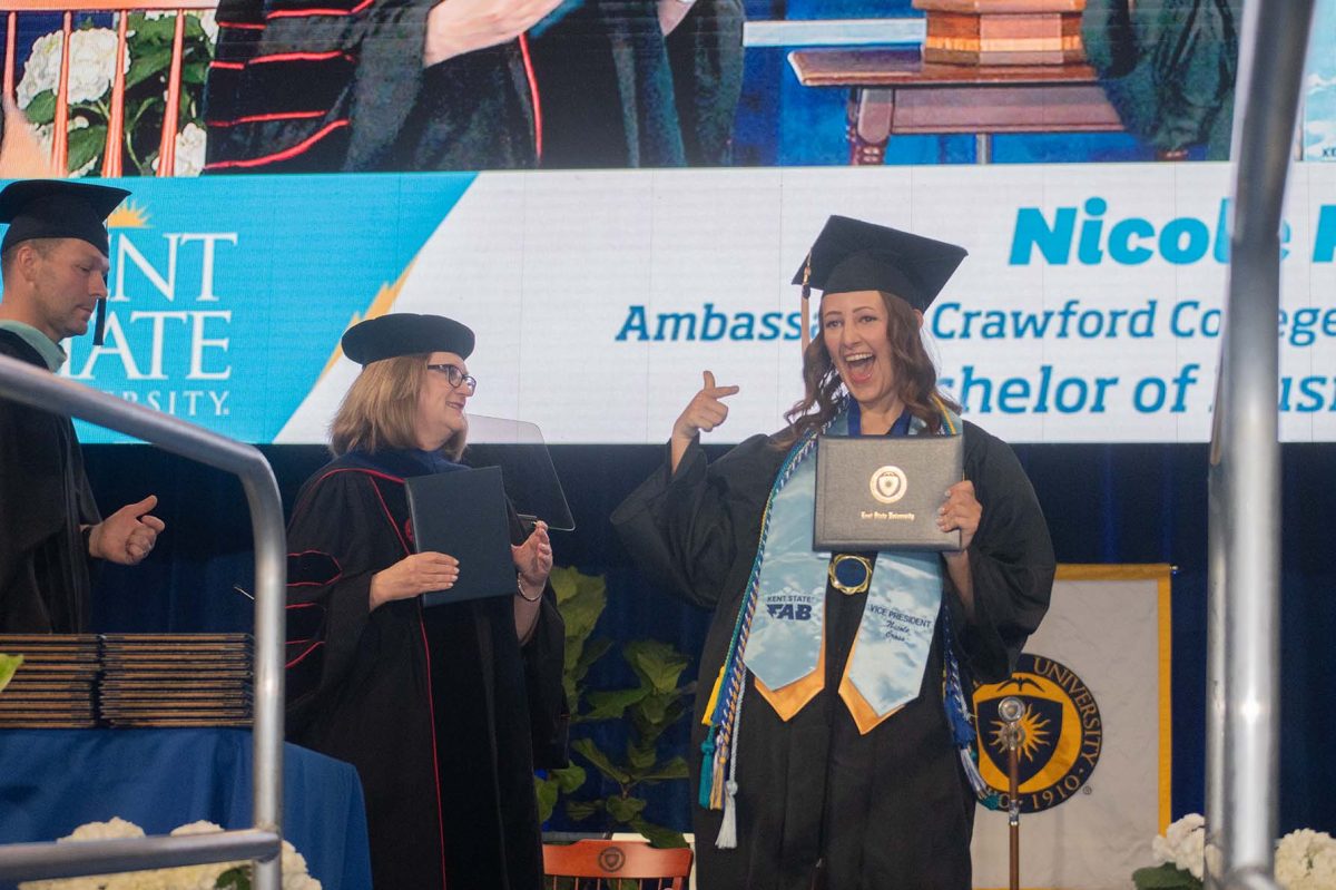 Nicole Cross poses as she receives her degree on Saturday, May 10th, 2025. 