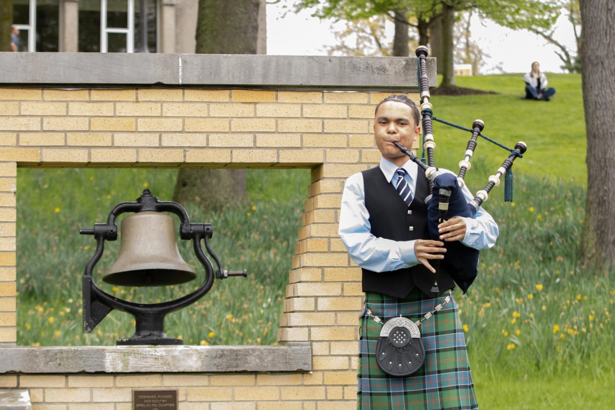 Columbus community member Brody Alexander performs Amazing Grace at the victory bell after the May fourth commemoration on Sunday, May 4, 2025.