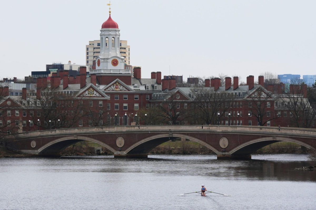 A sculler rows down the Charles River near Harvard University on April 15, 2025, in Cambridge, Mass.
