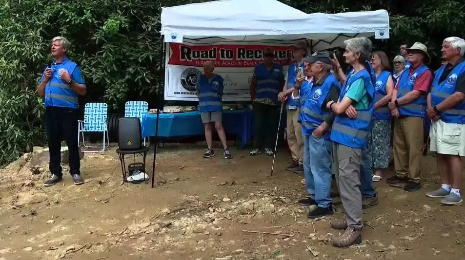 High Rock Acres community members celebrated the start of road repair and recovery eight months after Hurricane Helene. The Black Mountain community was cut off for more than a week after the storm.
